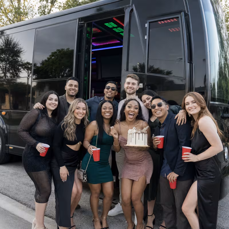 Party bus interior with wraparound leather seating and LED lighting in Gilbert