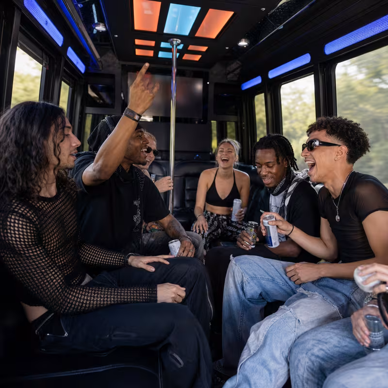 Passengers loading luggage while boarding an Gilbert group shuttle