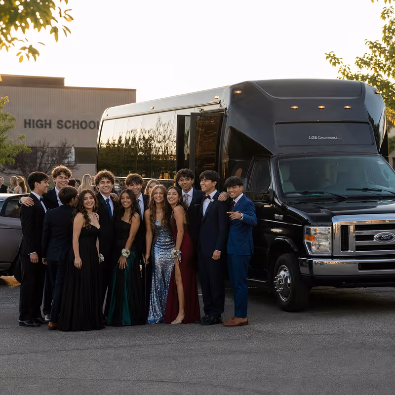 Group boarding a white charter bus for Prom & Homecoming Transportation transportation in Gilbert