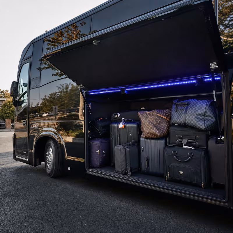 Party bus interior with wraparound leather seating and LED lighting in Gilbert