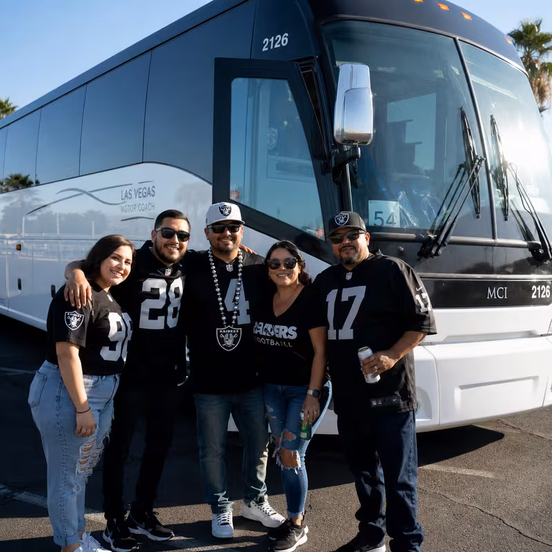 Passengers loading luggage while boarding an Gilbert group shuttle