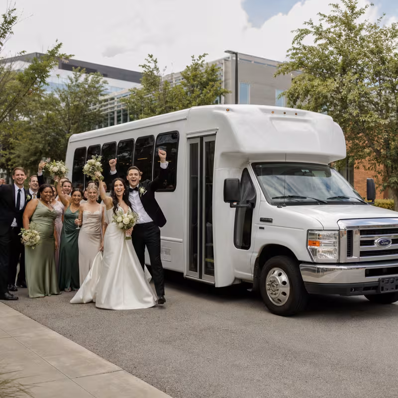 Passengers loading luggage while boarding an Gilbert group shuttle
