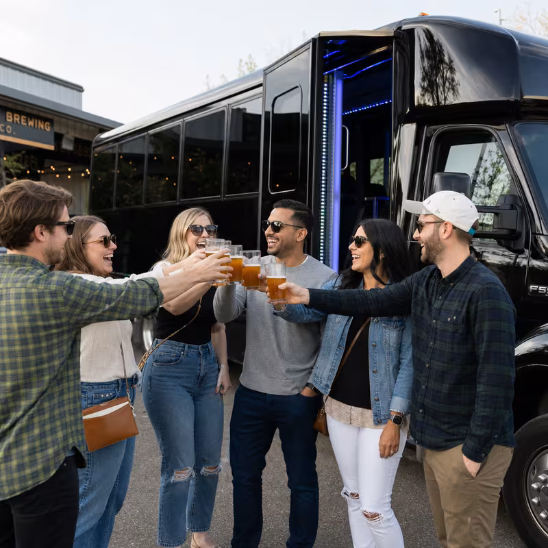 Passengers loading luggage while boarding an Gilbert group shuttle